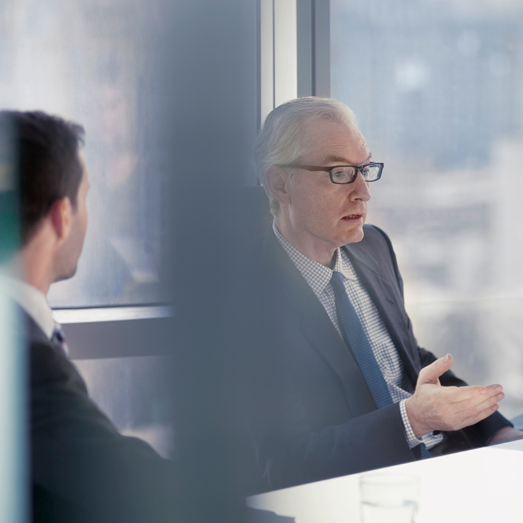 Legal team talking to client in an office